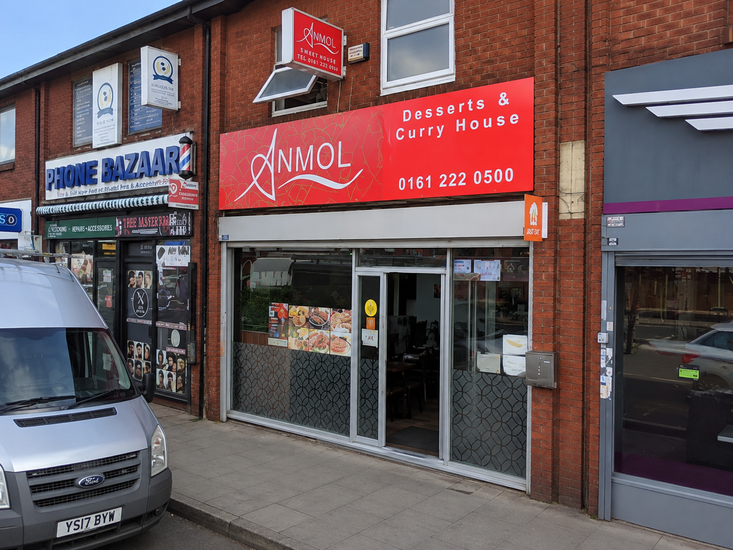 Anmol Sweet House desserts and curry house entrance in Manchester